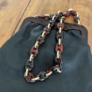 tortoise shell acrylic link and hard wear small black Italian leather handbag